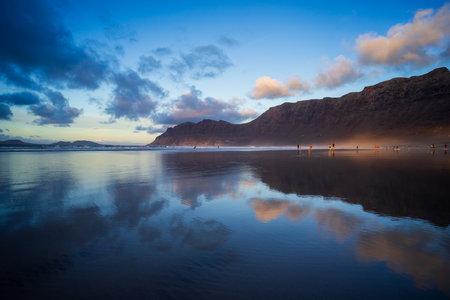 The evening's Famara Beach (Playa de Famara) -  popular surfing beach in Lanzarote. Canary Islands. Spain.の写真素材