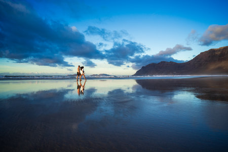 The evening's Famara Beach (Playa de Famara) -  popular surfing beach in Lanzarote. Canary Islands. Spain.の写真素材