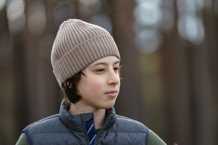 Portrait of a teenager against a background of nature.の写真素材