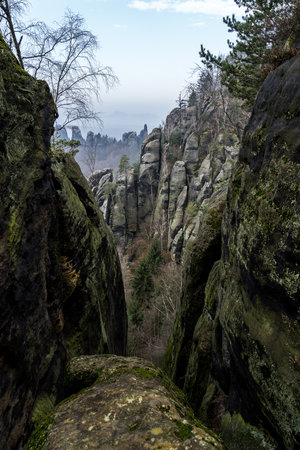 An early morning in mountain. Schrammsteine - group of rocks are a long, strung-out, very jagged in the Elbe Sandstone Mountains located in Saxon Switzerland in East Germany.の写真素材