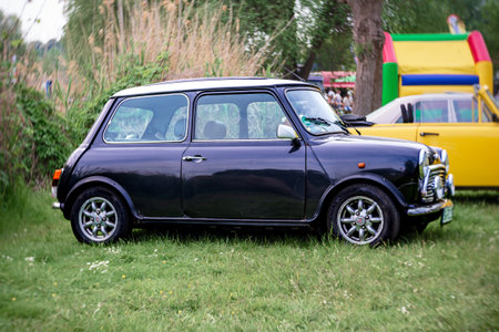 WERDER (HAVEL), GERMANY - MAY 20, 2023: The supermini, city car Rover Mini. Swirl bokeh. Art lens....