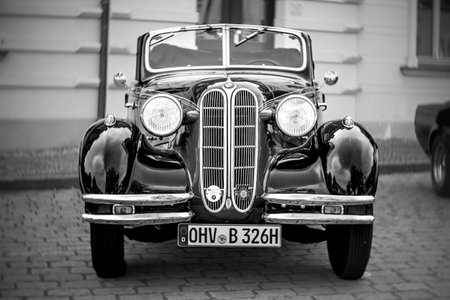 WERDER (HAVEL), GERMANY - MAY 20, 2023: The mid-size car BMW 326 Cabriolet. Swirl bokeh, art lens. Black and white. Oldtimer - Festival Werder Classics 2023のeditorial素材