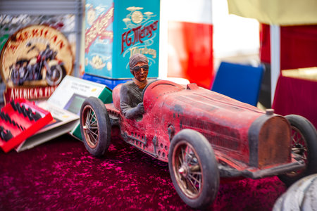 LINTHE, GERMANY - MAY 27, 2023: Toy racing car. Flea market at the exhibition. Art lens. Swirl bokeh. Die Oldtimer Show 2023.のeditorial素材