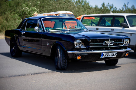 LINTHE, GERMANY - MAY 27, 2023: The muscle car Ford Mustang, 1965. Art lens. Swirl bokeh. Die Oldtimer Show 2023.のeditorial素材