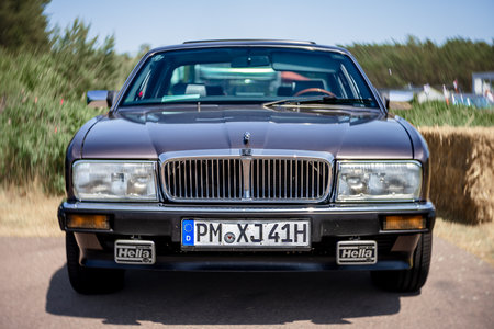 LINTHE, GERMANY - MAY 27, 2023: The full-size luxury car Jaguar XJ (XJ40). Art lens. Swirl bokeh. Die Oldtimer Show 2023.のeditorial素材