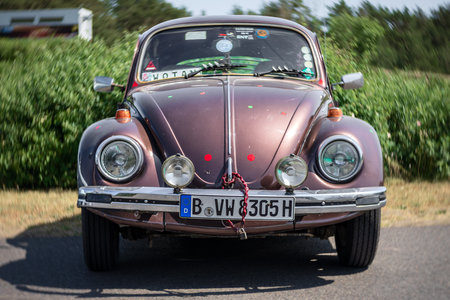 LINTHE, GERMANY - MAY 27, 2023: The subcompact, economy car Volkswagen Beetle. Art lens. Swirl bokeh. Die Oldtimer Show 2023.のeditorial素材