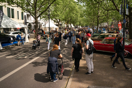 BERLIN - MAY 04, 2024: Exhibitors, tourists and visitors on the famous Kurfuerstendamm shopping street. Classic Days Berlin 2024.のeditorial素材