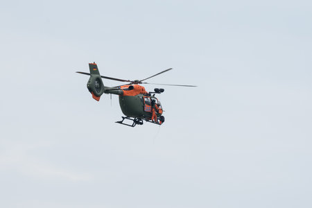 BERLIN - JUNE 05, 2024: The demonstration flight of light utility helicopter Airbus H145 SAR (Search...