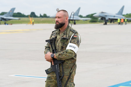 BERLIN - JUNE 05, 2024: A soldier of the Bundeswehr security company on the airfield. ILA Berlin Air Show 2024.のeditorial素材