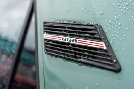 LINTHE, GERMANY - JUNE 08, 2025: The classic side vent trim with Skoda script badge on 130 L sedan in rain. Die oldtimer show.のeditorial素材