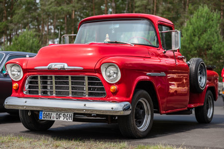 LINTHE, GERMANY - JUNE 08, 2025: Red American pickup truck Chevrolet 3600 Task Force series, 1955. Die oldtimer show.のeditorial素材