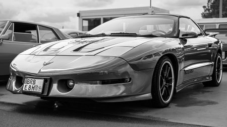 LINTHE, GERMANY - JUNE 08, 2025: Sports car Pontiac Firebird Trans Am coupe, 1993-1997. Black and white. Die Oldtimer Show.のeditorial素材