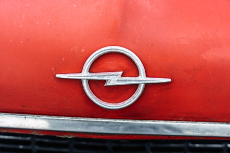 GERMANY, LINTHE - JUNE 08, 2025: Opel emblem on aged red paint surface. Die oldtimer show.