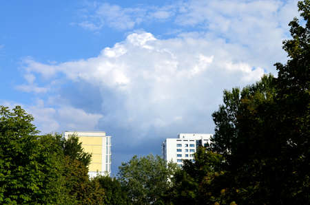 apartement houses in former eastern berlin with trees and skyの写真素材