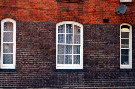 British window in a brick wallの写真素材