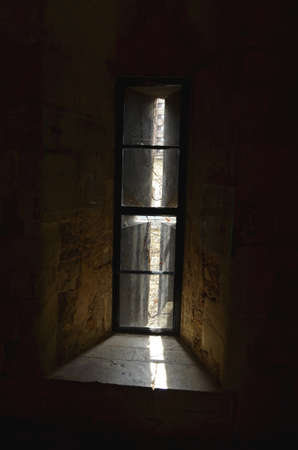 View through an old Window with sunbeamの写真素材