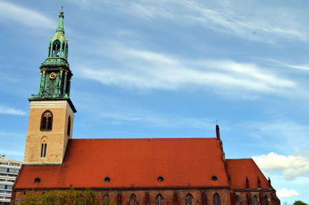 old church of st mary in berlin city with blue skyの写真素材