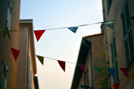 colorful penants in an narrow alley in france