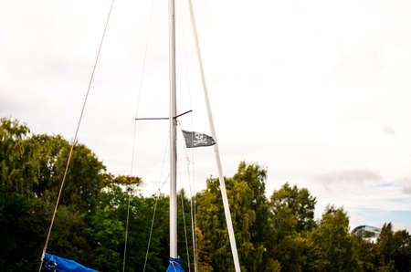 pirate flag on a ship blowing in the windの写真素材