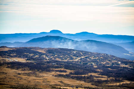 blue mountain landscape and morning fog in Norwayの写真素材