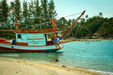 colorful fishing boat at tropical beachの写真素材