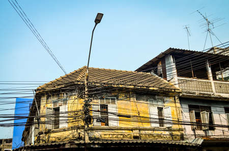 A lot of electrical wires on electricity pylon in Thailandの写真素材