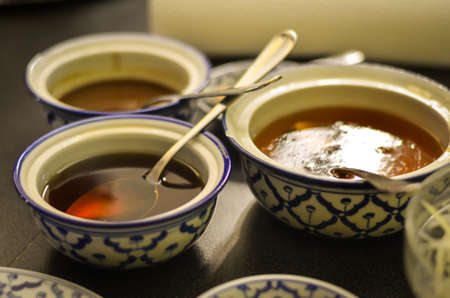 spices and sauces prepared for thai cookingの写真素材