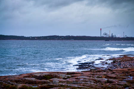 rough landscape in autumn with factories in backgroundの写真素材