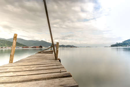 longtime exposure at wooden jetty close to a pierの写真素材