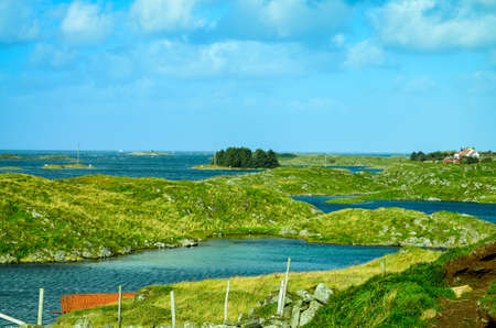 green hilly island landscape in western norwayの写真素材