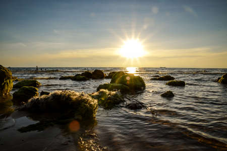 tropical beach short before sunset time with sunraysの写真素材