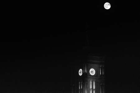 red city hall of Berlin during fullmoon