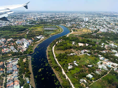 airplane view over Saigon and Mekong Riverの写真素材