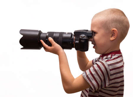 the photograph depicts a child with a cameraの写真素材