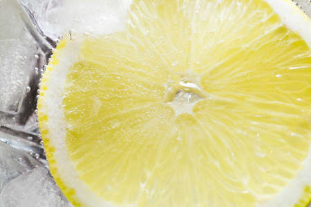 The photo depicts a lemon in bubblesの写真素材