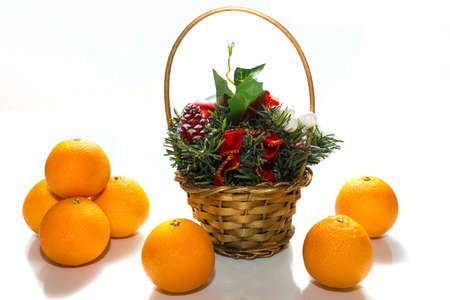 depicted in the photo tangerine and a basket with candyの写真素材