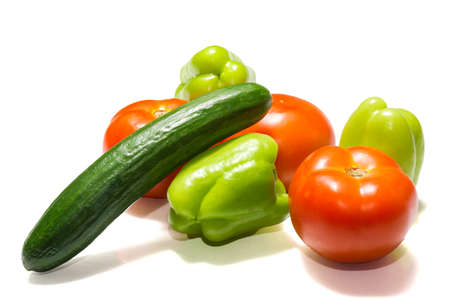The photo shows vegetables on a white backgroundの写真素材