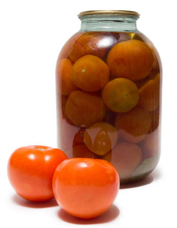 The photograph shows a bank with tomatoes on a white backgroundの写真素材