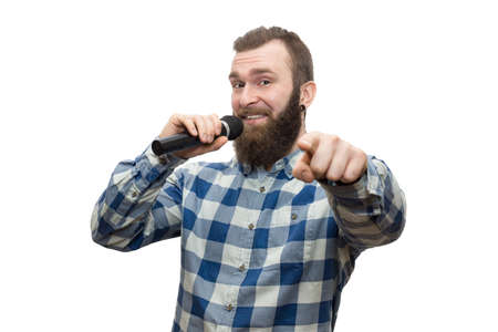 The photo depicts a man with a microphoneの写真素材