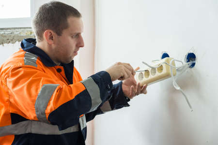 the photograph depicts a man who makes the socket