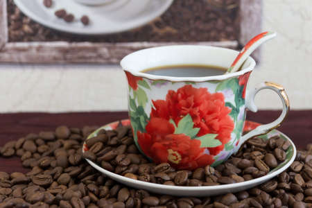 The photo shows a cup of coffee