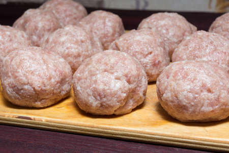 The photo shows the cutlets on a cutting boardの写真素材