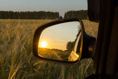 Reflection in the sunset mirror in the wheat field, Russia, village, summer, 2017の写真素材