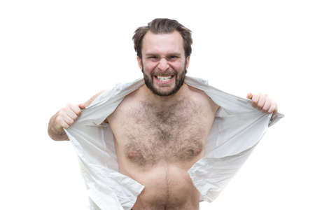 The bearded man tearing his shirt in anger, white background, isolationの写真素材
