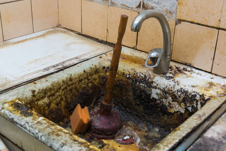 old clogged a sink in the rust, the old kitchen, clogged sinkの写真素材