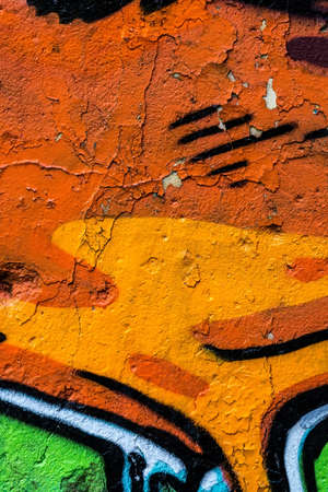 old concrete painted wall with cracks and graffitiのeditorial素材