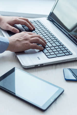 man working on laptop in office, businessの写真素材
