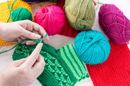 girl knits sock knitting needles on white background