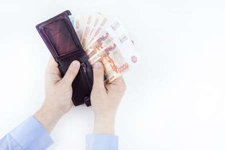 purse with money in hands on a white background