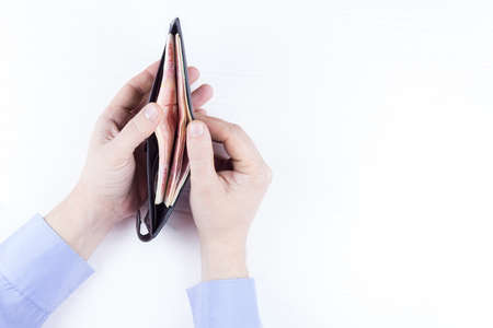 purse with money in hands on a white backgroundの写真素材